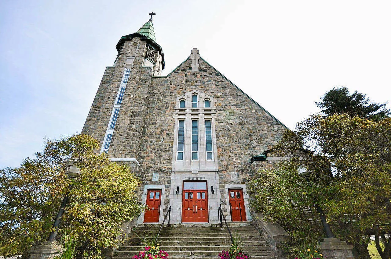 Sainte-Amélie Church’s pink granite façade and copper steeple
